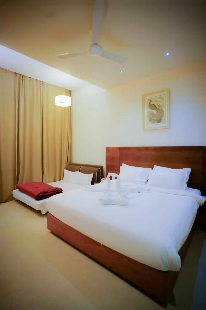 Comfortable guest room at Chattarpur Farms in Nagpur