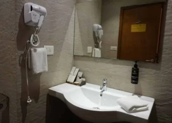 Bathroom amenities in a deluxe room at Chattarpur Farms in Nagpur