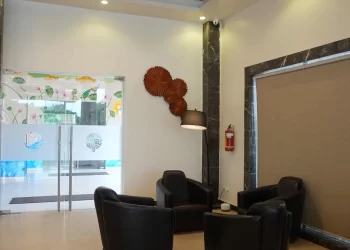 Guest room corridor at Chattarpur Farms in Nagpur