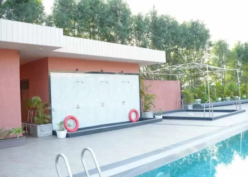Poolside amenities at Lotus Lagoon at Chattarpur Farms in Nagpur