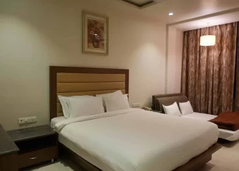 Spacious deluxe room at Chattarpur Farms wedding venue in Nagpur