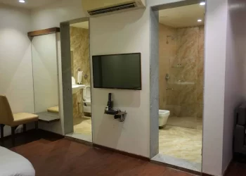 Family room with attached bathroom at Chattarpur Farms in Nagpur