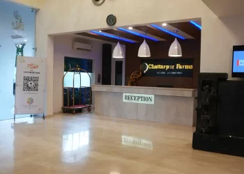 Reception lounge seating at Chattarpur Farms in Nagpur