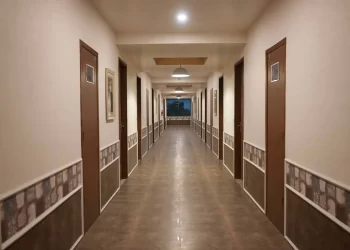 Guest room corridor at Chattarpur Farms in Nagpur