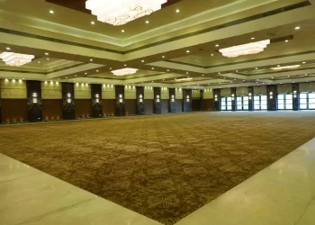 Large banquet space inside Carnation Hall at Chattarpur Farms in Nagpur