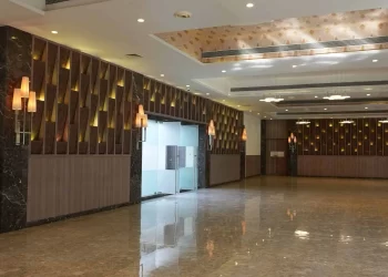 Spacious interior of Iris Hall wedding hall at Chattarpur Farms in Nagpur
