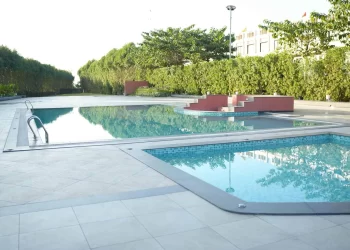 Outdoor swimming pool at Lotus Lagoon in Chattarpur Farms Nagpur